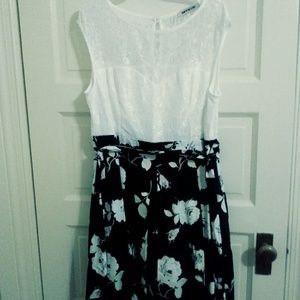 Dress with bow tie. Slip sewn inside dress.